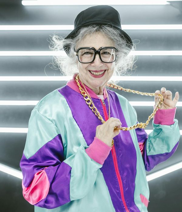 Active woman feeling energetic and smiling in a bright studio.